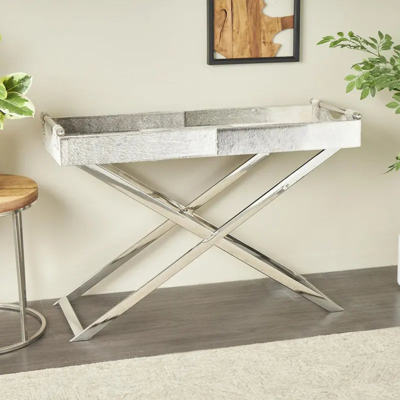 Table d'appoint en cuir de vache avec pieds diagonaux en acier inoxydable