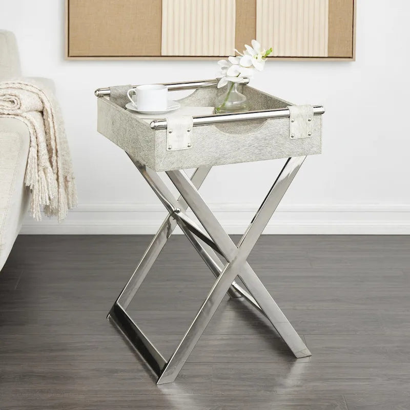 Table d'appoint en cuir de vache avec pieds diagonaux en acier inoxydable